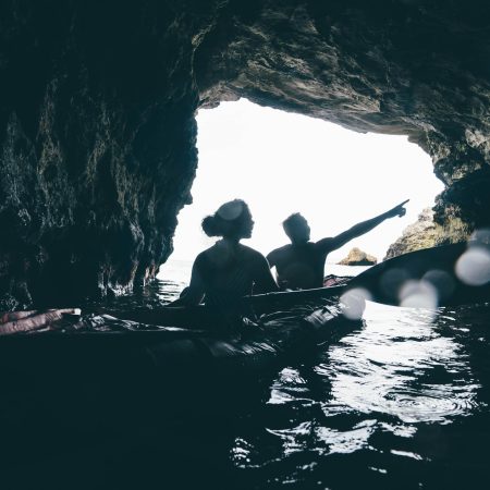 Couple swimming at caves