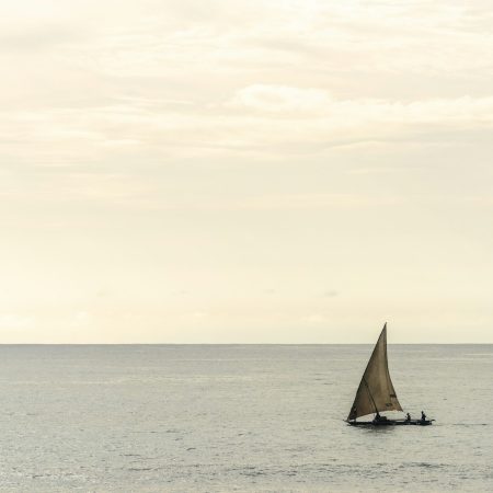 Dhow fishing boat at sunrise at Watamu Bay Beach, Watamu, Kilifi County, Kenya