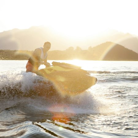 Man riding jet ski on lake, Beijing, China