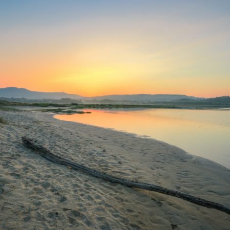 Sunrise over the sandbanks of an estuary