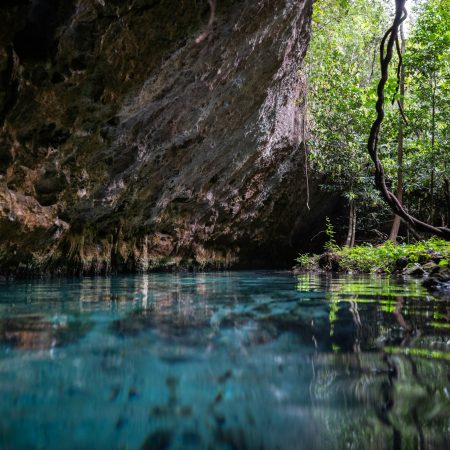 Underground caving and swimming in Sac Actun cave system in Tulum Mexico