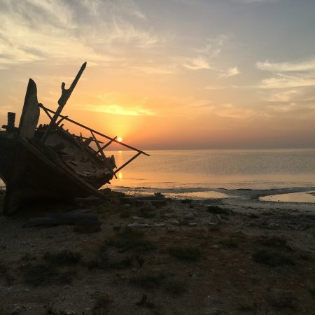 Wooden dhow by beach at sunrise.Qatar. Traditional dhow, Visit Qatar, explore Qatar, culture, sunset